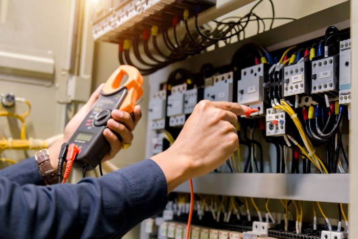 Electrician engineer work tester measuring voltage