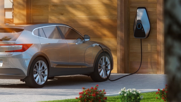 electric car suv parked in front of home